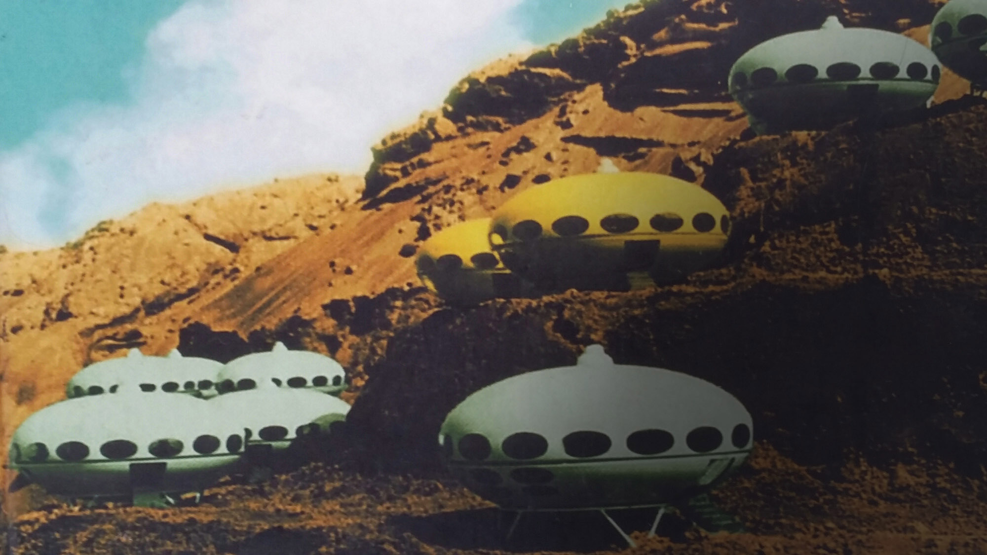 10 flying saucers landed in a mars-like desert scape. 