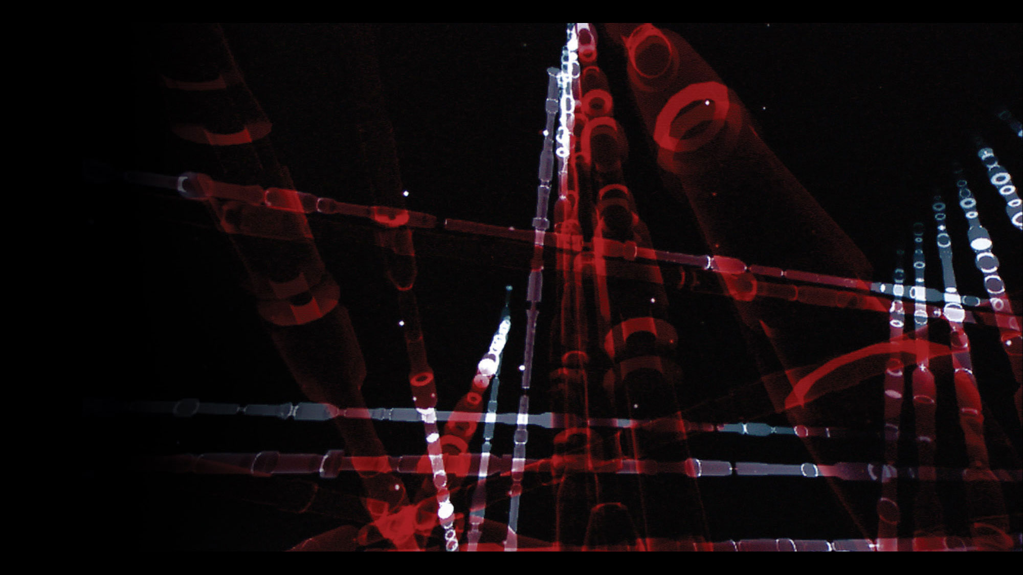 Abstract beams of red and white light in almost bamboo like tubes. 