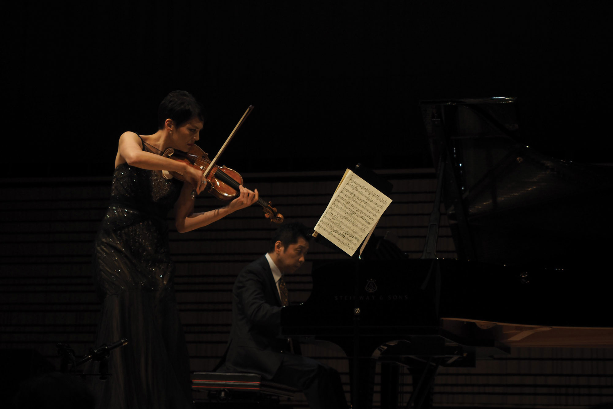 anne akiko meyers in the concert on the concert hall stage. 