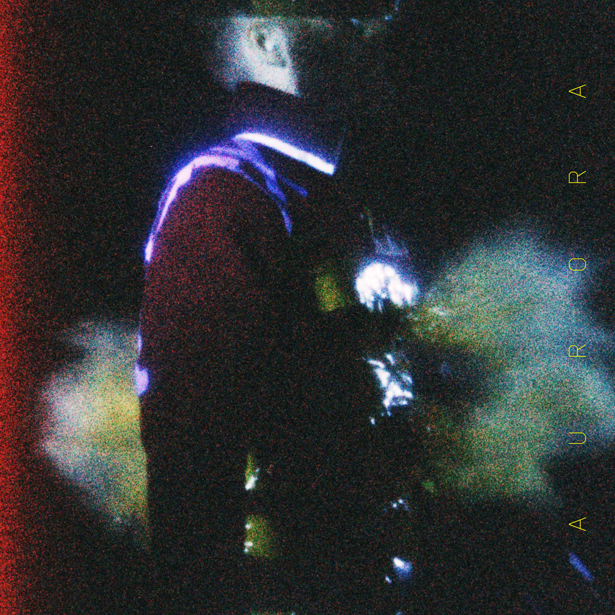 a pixelated person in a military jacket with green and yellowed colored lights projected and face in shadow, Aurora. 