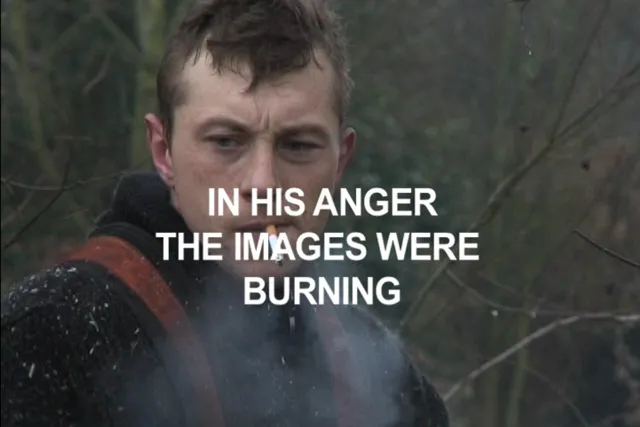 A man standing in the woods smoking a cigarette with white text over his face reading "in her mind the images were burning". 