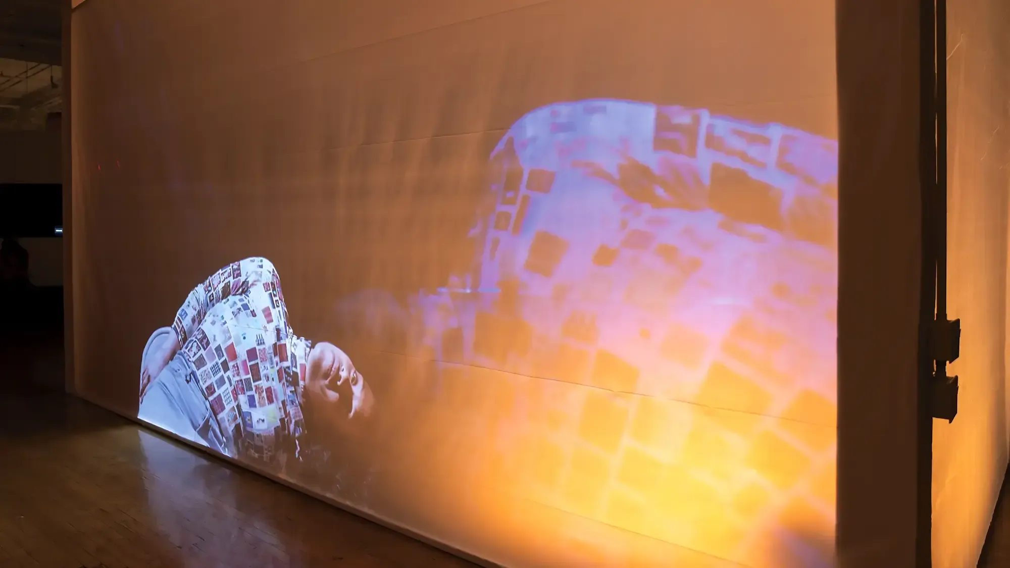 a sideways-bent body projected on a large screen